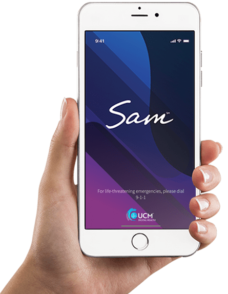 Hand holding phone showing the SAM app